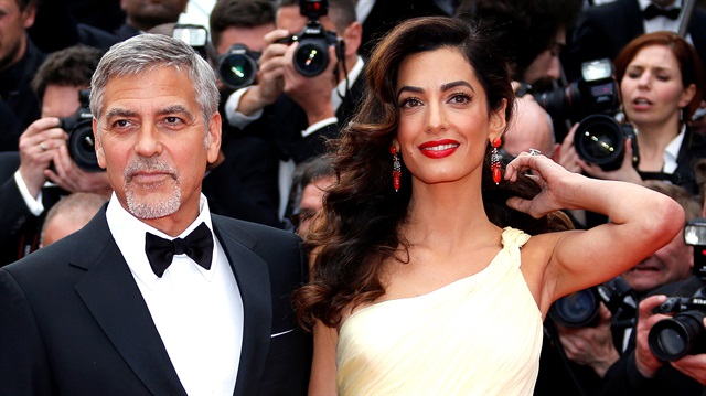 Actor Geogrge Clooney and his wife Amal on the Cannes Film Festival red carpet.