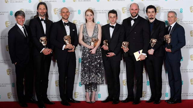 The team behind 'La La Land" hold their awards for Best Film at the British Academy of Film and Television Awards (BAFTA) at the Royal Albert Hall in London