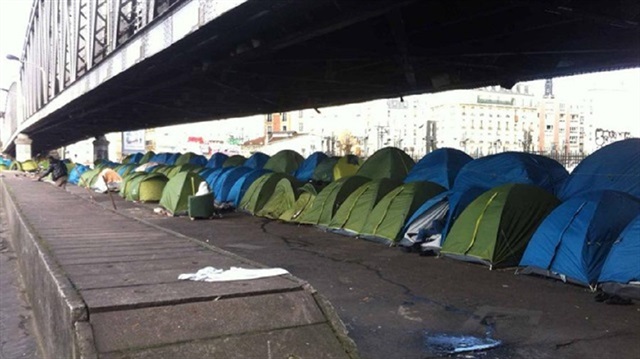 Unsheltered asylum seekers in Paris are living in tents in freezing temperatures.