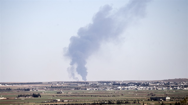 Pillars of smoke rise from al-Bab city in Syria.