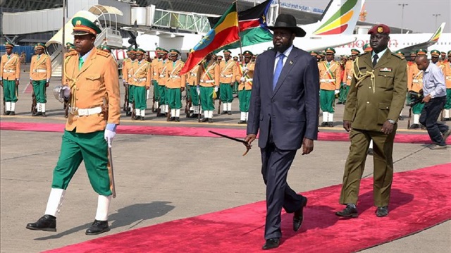 President of South Sudan Salva Kiir Mayardit is welcomed by Ethiopian Prime Minister Hailemariam Desalegn (not seen) during an official welcoming ceremony at Addis Ababa Bole International Airport in Addis Ababa, Ethiopia