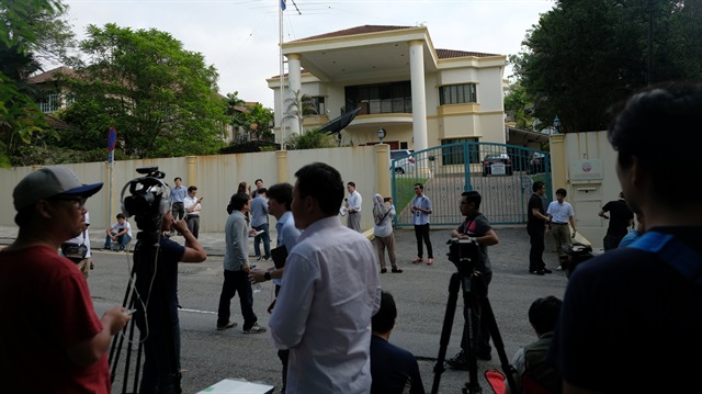 Members of the media gather in front of the North Korea embassy in Kuala Lumpur