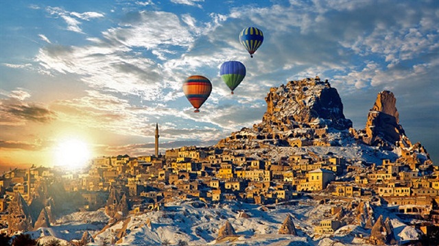 Hot air balloons float over Cappodocia, Turkey.