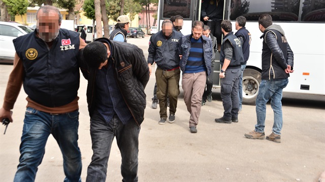 Turkish security forces escort detained suspects in Adana, Turkey