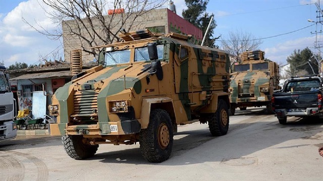 Military vehicles and personnel are headed towards the Syrian border by land