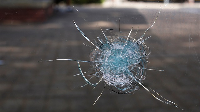 Broken glass from a bullet hole