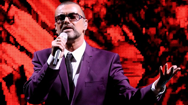 Late British singer George Michael performs on stage during his "Symphonica" 