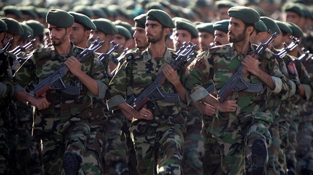 Members of Iran's Revolutionary Guards march during a military parade