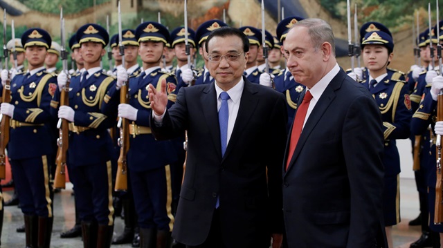 Israeli Prime Minister Benjamin Netanyahu and China's Premier Li Keqiang attend a welcoming ceremony in Beijing.