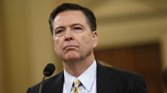 FBI Director James Comey waits before testifying at a House Intelligence Committee hearing 