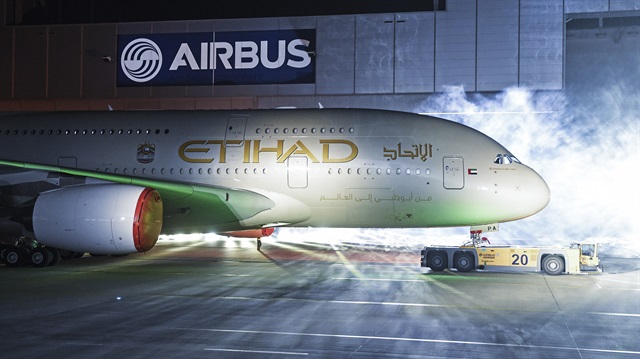 An Airbus A380 rolls out of a paint hangar during a branding ceremony of Etihad Airways, 