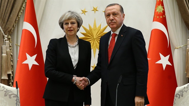 Theresa May (L) and Recep Tayyip Erdoğan (R). 