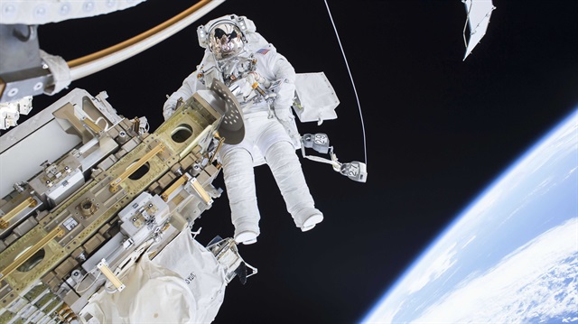 Expedition 46 Flight Engineer Tim Kopra performs a spacewalk outside the International Space Station