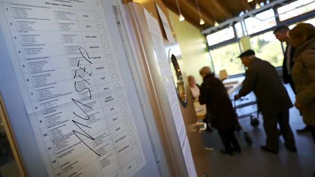 People cast their vote for the Saarland state elections in Puettlingen near Saarbruecken