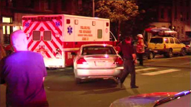 Ambulances rush to the scene of the shooting