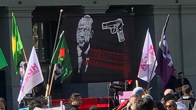 The weekend rally by the PKK in Switzerland featured a large banner with a picture of a gun pointed at the head of Turkish President Recep Tayyip Erdoğan and the words “Kill Erdoğan". 