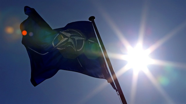 A NATO flag flies at the Alliance's headquarters in Brussels