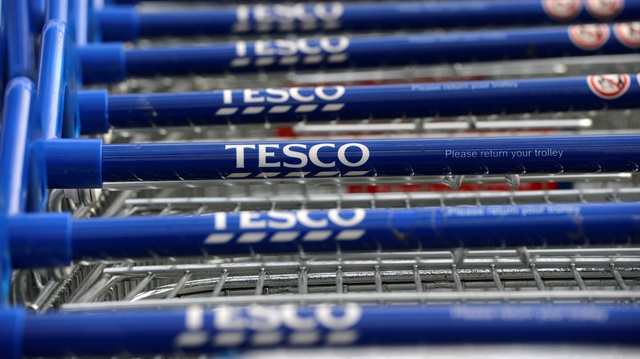 Trolleys are stacked outside a Tesco store in London, Britain