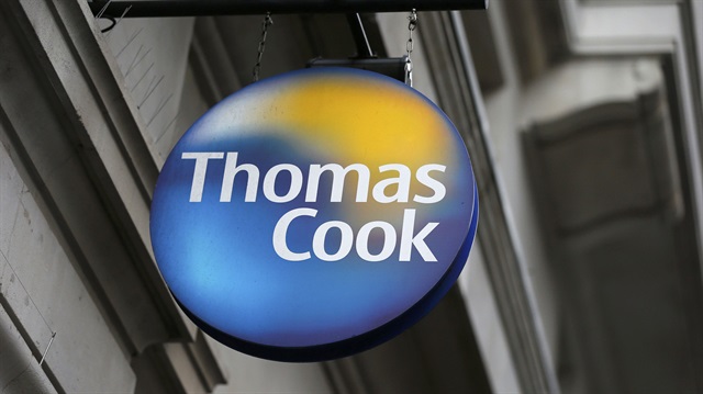 A sign is seen outside a Thomas Cook shop in central London