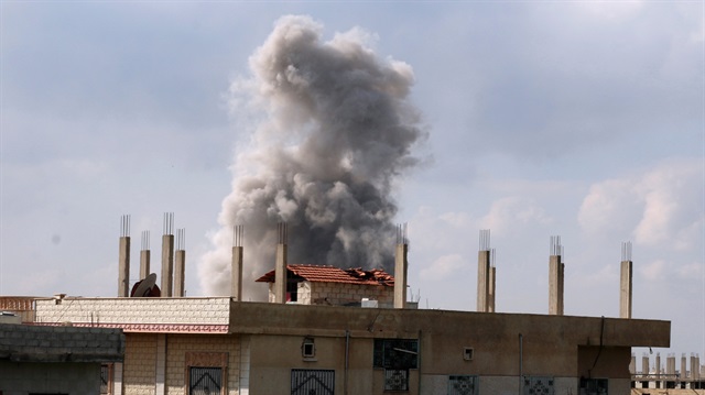 Smoke rises after a regime airstrike on Idlib