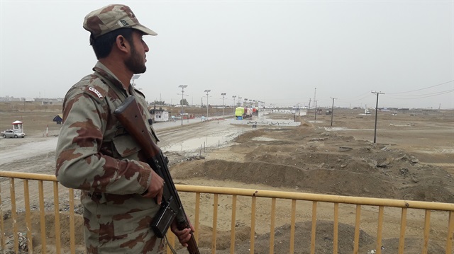 A Pakistan soldier stands guard