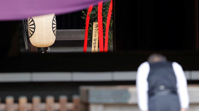 A wooden sign which reads "Prime Minister Shinzo Abe" is seen on a ritual offering, a "masakaki" tree, from Abe to the Yasukuni Shrine, inside the main shrine at the controversial shrine for war dead, in Tokyo.