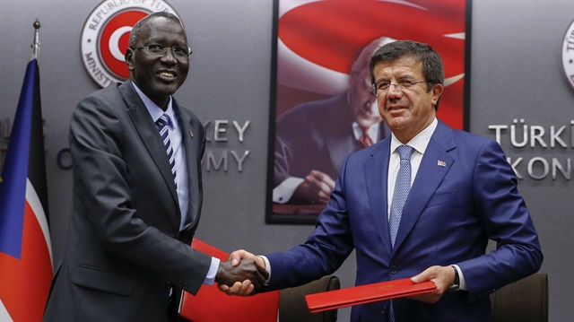 South Sudan's Finance Minister Stephen Dhieu Dau (L) and Turkey’s Minister of Economy Nihat Zeybekçi