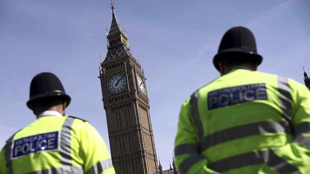 Police officers patrol in Parliament Square following the attack in Westminster 