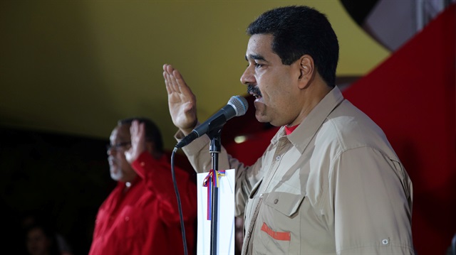 Venezuela's President Nicolas Maduro gestures while he speaks during a meeting