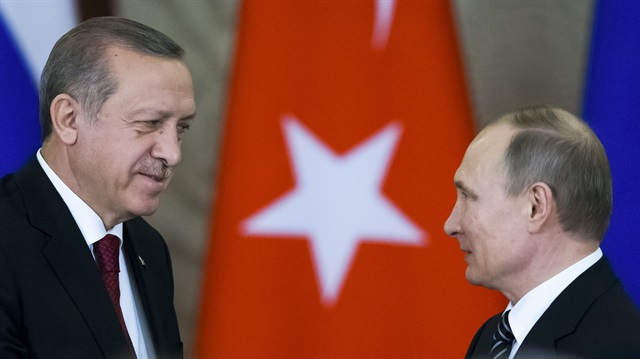Russian President Putin shakes hands with his Turkish counterpart Erdogan after the talks in Moscow.