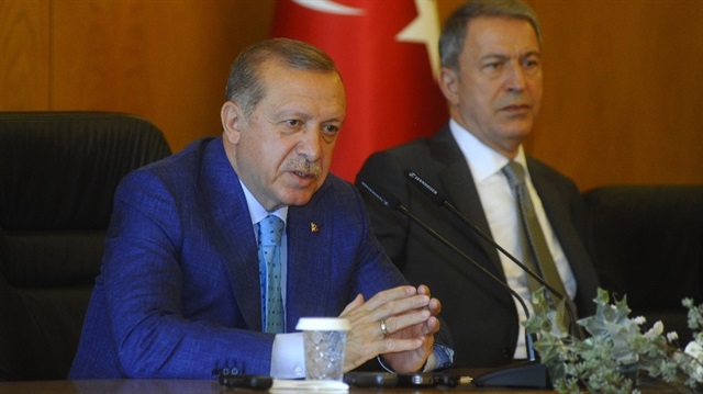 Turkish President Recep Tayyip Erdoğan (L). 
