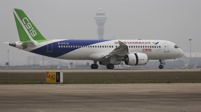 China's home-grown C919 passenger jet lands during its first flight at Pudong 