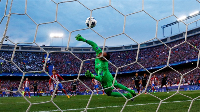 Atletico Madrid's Antoine Griezmann scores their second goal from the penalty spot.