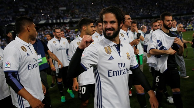 Real Madrid’s Isco and team mates celebrate after winning La Liga