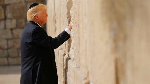 U.S. President Donald Trump places a note in the stones of the Western Wall, Judaism's holiest prayer site, in Jerusalem's Old City May 22, 2017.