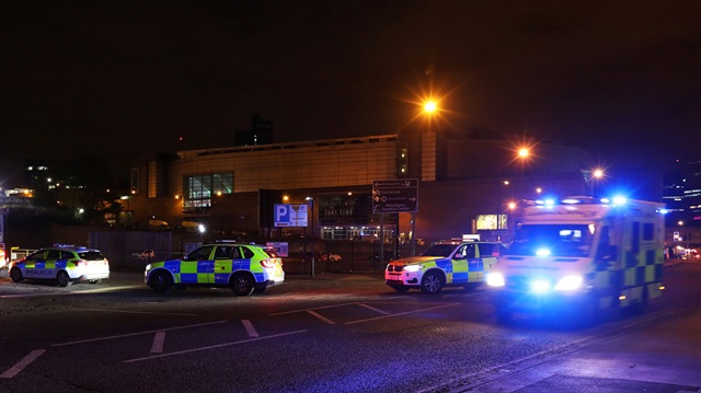 Police vehicles are seen outside the Manchester Arena, where U.S. singer Ariana Grande had been performing, in Manchester, northern England, Britain May 23, 2017.