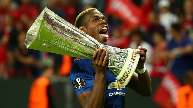 Manchester United's Paul Pogba celebrates with the trophy after winning the Europa League.