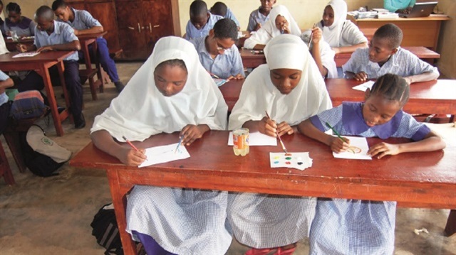 Children in Kenya take Qur'an lessons during Ramadan. 