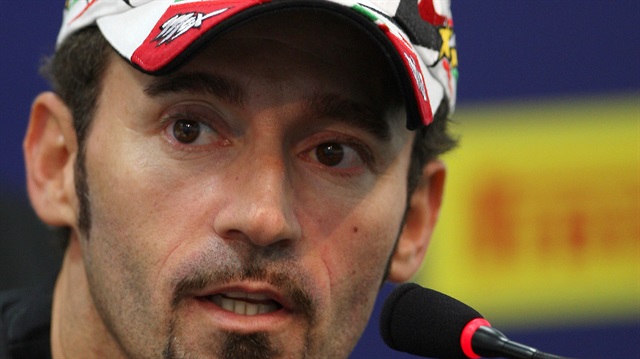 Italy's superbike rider Max Biaggi talks during a news conference at the Superbike World Championship at the Losail international circuit in Doha March 12, 2009.