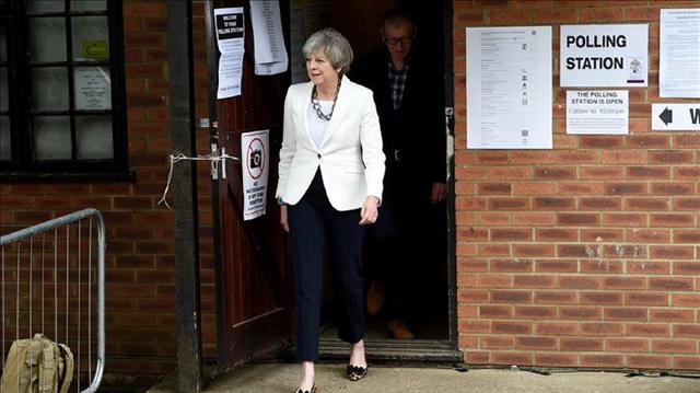 Conservative Party leader Theresa May and husband Philip arrive at a polling station to vote on June 8, 2017 in Maidenhead, United Kingdom. Polling stations have opened as the nation votes to decide the next UK government in a general election.