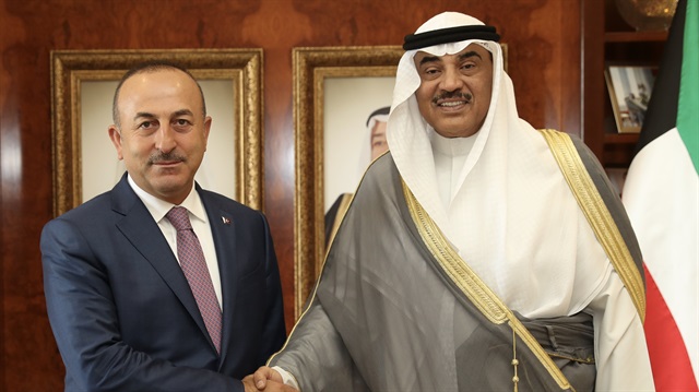 Turkish foreign minister (L) and Kuwait's foreign minister (R). 