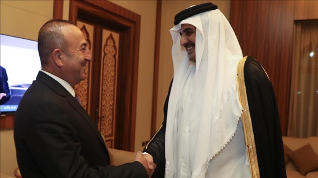 Turkish Foreign Minister Mevlüt Çavuşoğlu (L) meets with Emir of Qatar Tamim bin Hamad Al Thani (R) in Doha, Qatar on June 14, 2017.