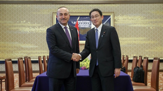 Foreign Minister of Turkey Mevlüt Çavuşoğlu (L) shakes hands with Japanese Foreign Minister Fumio Kishida (R) during his official visit in Tokyo, Japan on June 21, 2017.
