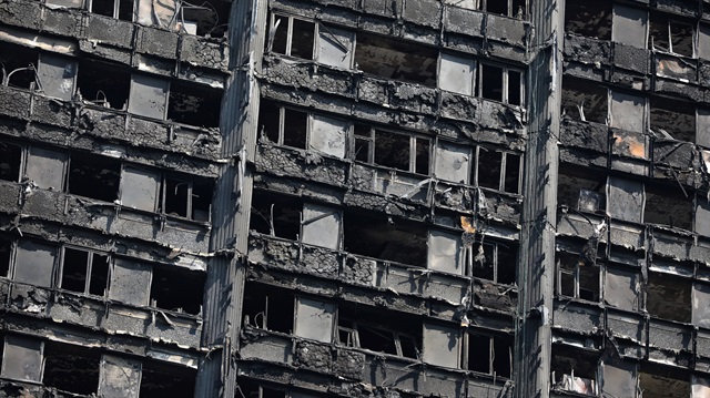 The burnt out remains of the Grenfell Tower are seen in North Kensington, London
