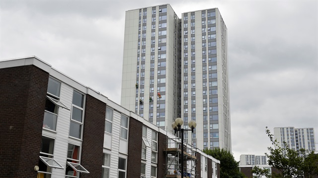Window cleaners work on a tower block on the Chalcots estate in Camden