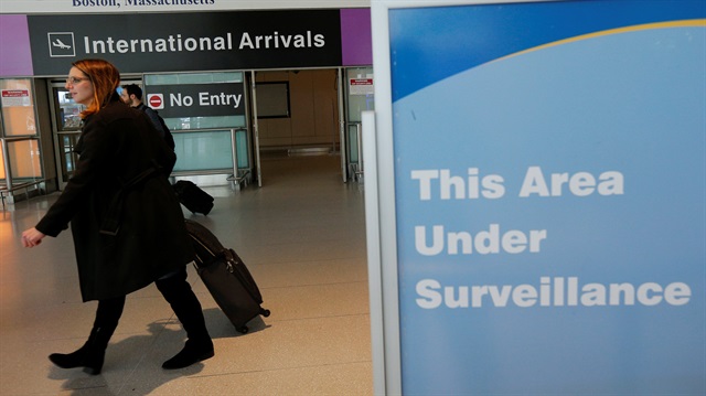 International travelers arrive at Logan Airport 