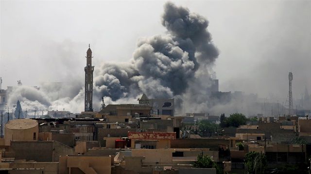 Smoke rises from an airstrike during a battle between Iraqi forces and Daesh in Mosul
