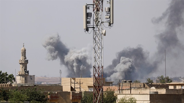 Smoke billows after an air strike by Iraqi forces toward Daesh