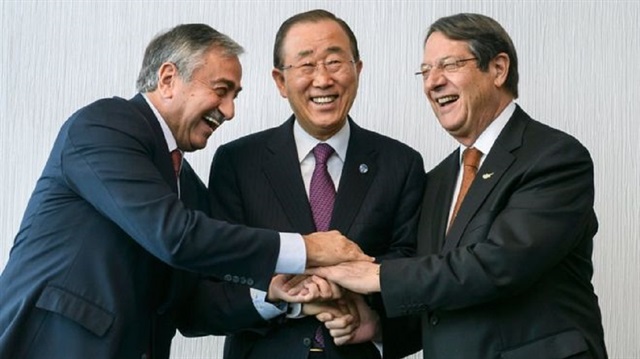 UN chief Ban Ki-moon (C) is overseeing talks between the Turkish Cypriot (L) and Greek Cypriot leaders