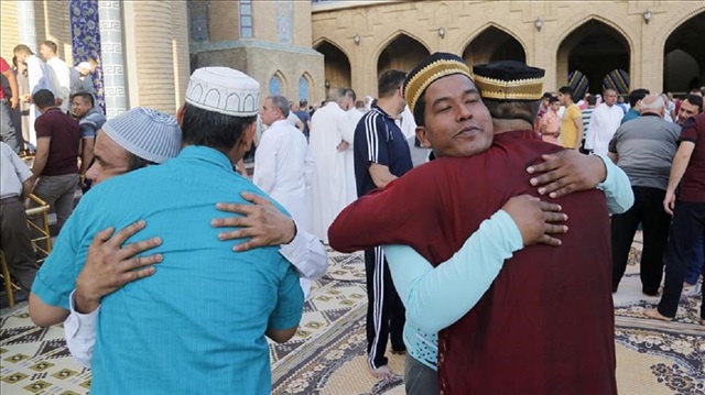Muslims greet each other after performing Eid al-Fitr prayer at Celil Hayat Mosque in Erbil, Iraq on June 25, 2017. Eid al-Fitr is a religious holiday celebrated by Muslims around the world that marks the end of Ramadan, Islamic holy month of fasting. 